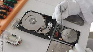 Engineer fixing broken computer hard drive. Electronic repair shop, technology development concept