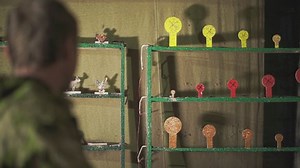 a man from a pneumatic pistol in a shooting range shoots at targets. High-quality Full HD video recording. slow motion video