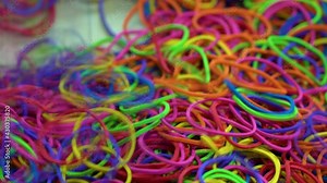 Many multi-colored rubber elastic bands, Fell into the pile on rubber colorful.
