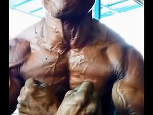 Flexing And Checking Muscle After Tanning And Prepare Competition