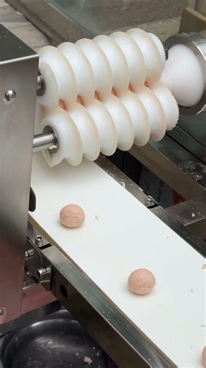 Food rounding machine with customizable sizing.
