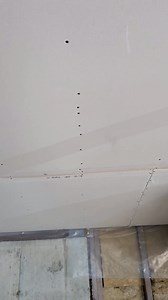 So this drywall was laying around for a very long time and it's 5/8 fire rated drywall making it quite expensive, especially since they're 12-ft sheets. So most of the sheets were like just a little wavy like this. But the ones at the bottom were really bad and really a pain to work with. But by the time we put them up, mudded them, sanded them and painted it. You could hardly noticed. Home improvement, project DIY tips and tricks for you #carpentrytips #construction #contractor #tipsandtricks #