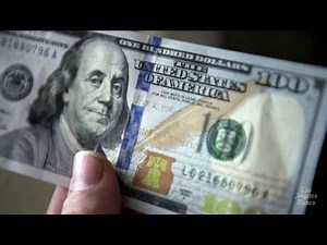 Redesigned $100 bills debut with new security features