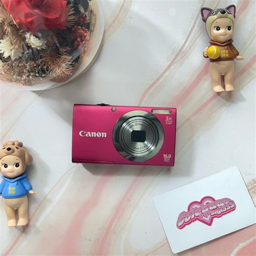 00s early camera digital & phone on Instagram: "CANON POWERSHOT A2300 body 9,8/10 16.1 Megapixels (with CMOS SENSOR) all functions normal zoom in out normal flash on off normal highly recommended!! 💅🏽 IT GILRS CAM 💋 with a tons of effect dan mode 📸 Mincole’s Fav 🤩 minus : ❌❌❌ includes battery, original charger, pouch, memory card, strap, card reader price : SOLD!!!"