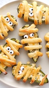 Mummy Jalapeño Poppers 🎃 These cute, spicy Mummy Jalapeno Poppers, made with my Greek yogurt dough, are the perfect Halloween appetizer for your Halloween Party! #halloween #halloweenparty #halloweenfood #jalapenopoppers #kidfriendly | Skinnytaste