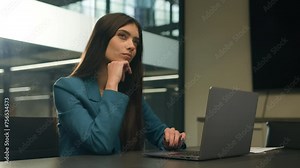 Thoughtful hesitate doubtful Indian woman work laptop in office pensive unsure puzzled Arabian girl choose compare idea decide female business manager computer think decision businesswoman thinking