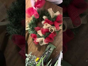 How to make a deco mesh Christmas winter wreath for your front door using an evergreen base.
