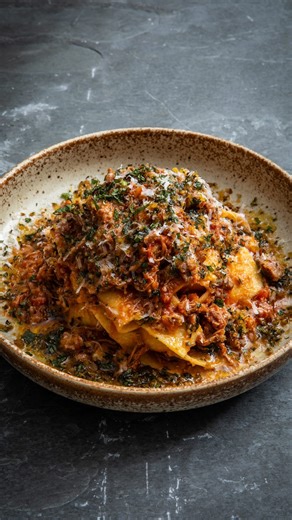 This silky, slow-cooked lamb ragù is the perfect winter comfort food. 🤤 The sauce is braised with the lamb in the oven, and is a great one to assemble in advance, and then enjoy the next day, or even freeze in batches. Pangrattato is a crispy Italian breadcrumb topping, and makes a great fresh and crunchy contrast to the rich ragù. 🍲 Find the full recipe via the link in our bio. | Great British Chefs
