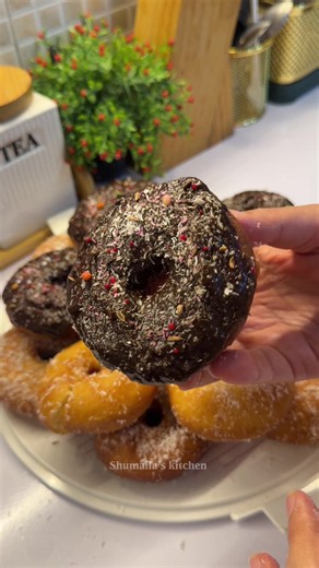 Soft Donuts With Simple Ingredients Ingredients: * 250 ml warm milk * ½ cup sugar (add more if you like it sweeter) * 1 tbsp instant yeast * 100 ml (½ cup) ghee or butter * 1 egg * Few drops vanilla essence * A pinch of salt * 3–4 cups maida * Oil for frying For coating: * Chocolate * Sugar * Coconut flakes #donuts #homemadedonuts