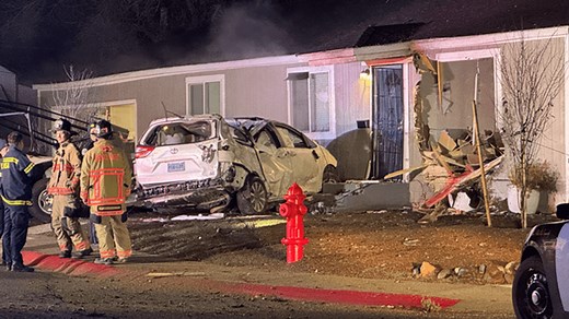 Car crashes into home in Reno, striking power pole and causing significant damage