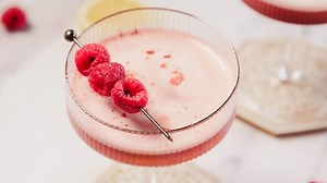 Elevate your cocktail game with our raspberry scotch sour recipe