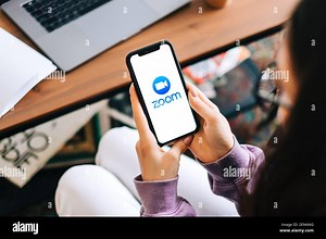 Zoom video conference app logo on the smartphone screen Stock Photo - Alamy