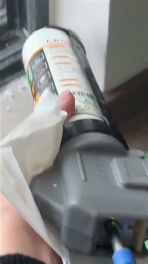 applying the white sealant precisely using a professional manual metal silicone glue tools activity