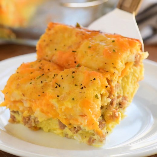 Start the day with a Tater Tot Breakfast Casserole with sausage, eggs, cheese, and tater tots all in one easy dish. Printable Recipe Card ➡️ https://www.thegunnysack.com/tater-tot-breakfast-casserole/ | The Gunny Sack