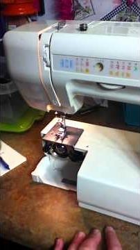 Aunt Jane showing how to load a bobbin on a Kenmore Sewing Machine