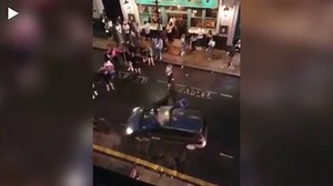 Taxi driver hurls England fan to floor after he climbs on top of cab