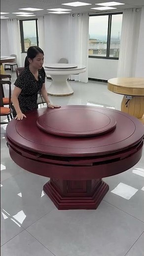 n expandable round solid wood dining table with an integrated rotating Lazy Susan turntable