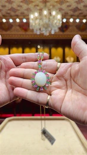 Sabhyata Jewels® on Instagram: "Ethereal Elegance in Precious Gemstones ✨ Presenting a refined 18 Karat Gold Pendant with Chain, meticulously handcrafted as a distinctive, one-of-one creation. At its heart lies a luminous Australian Opal, celebrated for its natural play of color, framed gracefully with Burma rubies, Zambian emeralds, and VS-grade diamonds. Each gemstone has been carefully selected and set to achieve perfect balance, brilliance, and harmony. The design flows seamlessly from penda