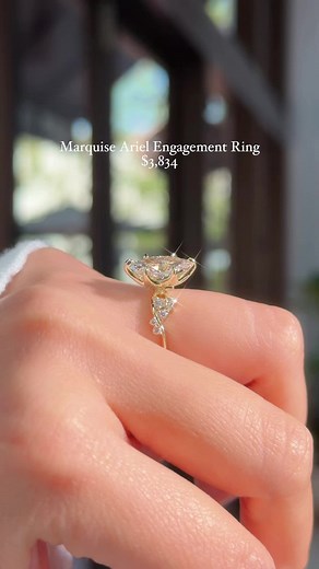 An engagement ring that is summer, embodied. ✨ Ocean bubble side diamonds, wave-like gold contours, & a sea flower petal prong basket – this is The Ariel 🫧 💍 2.01ct E-VS1 Marquise Lab Diamond Ariel Engagement Ring $3,834 🛍️ Shop now at PrincessBrideDiamonds.com ⚒️ Customize this ring to make it your own! Text us to get started ✨ 714.899.1122