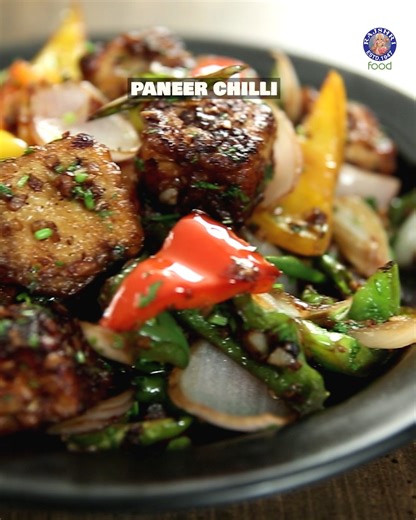Get ready to bring the heat of the streets right into your kitchen! 🌶️🔥 The Bombay Chef, Varun Inamdar, is here to show you how to master that quintessential Indo-Chinese favorite: Paneer Chilli. Host: Varun Inamdar Ingredients: 1 cup Thickly Sliced Assorted Capsicums 1 Large Red Onion (Petals) 1/2 tsp Chopped Ginger 2 tbsp Chopped Garlic 8 Sliced Green Chillies 350 gm Paneer 2 tbsp Light Soy Sauce Salt and pepper as required For Batter: 3 tbsp Refined Flour 1 tsp Rice Flour 3 tbsp Corn Flour 