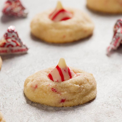 These CANDY CANE KISS COOKIES are my favorite holiday cookie! Print the complete recipe here: https://www.recipegirl.com/2008/08/08/candy-cane-kiss-cookies/ | RecipeGirl