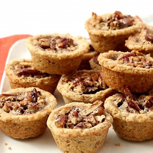 These tart-like cookies feature the flavors and textures of pecan pie -- tender, buttery crust, crunchy pecans, and brown-sugar filling -- all in one bite. https://trib.al/eY3RsGj | Martha Stewart