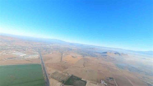 Man jumps from a hot air balloon at sunrise in a wild California wingsuit skydive