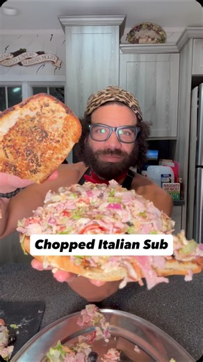 Blake Horton on Instagram: "Chopped Italian Sub on garlic bread!? A chopped Italian sandwich is a viral TikTok trend featuring a mix of chopped Italian cold cuts (like salami, pepperoni, and mortadella), provolone cheese, lettuce, tomatoes, and onions, all finely diced together with a dressing of mayonnaise, red wine vinegar, and Italian seasoning, then served on a sub roll. The key is chopping all ingredients together on a cutting board to blend flavors and create a uniform, easy-to-eat filling