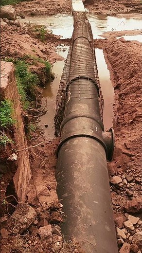 Installation of Scour valve tee and encasing of Ductile Iron pipe line.