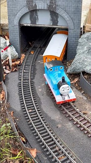 Thomas chuffs out of the tunnel with Annie and Clarabel.