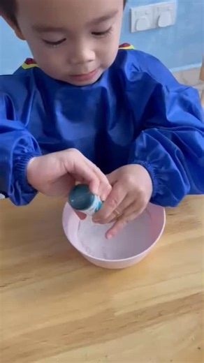The children mixed sugar with food colouring and pressed it into...