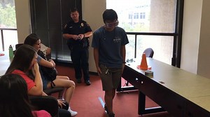 Students attempt walking a straight line using Fatal Vision goggles to conclude Officer Murphy's class on alcohol awareness. #BeSafe | The University of Texas at Austin Police Department (UTPD)