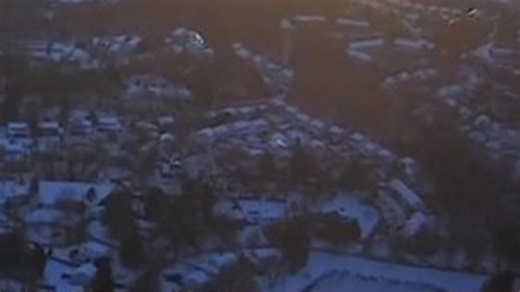 Aerial view from Sky9 heading towards Reston, VA, of widespread snowcrete blanketing the region