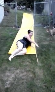 Woman Continuously Fails at Slip N Slide