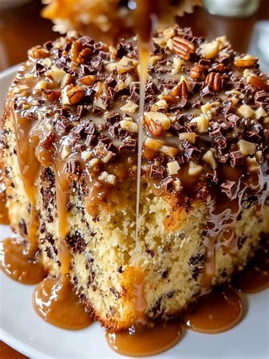 German Chocolate Pound Cake A rich, buttery pound cake swirled with chocolate and topped with a luscious caramel-pecan glaze and chocolate chunks. Yield: 10–12 slices Temperature: 325°F (165°C) Total Time: 1 hour 30 minutes Key Ingredients First: 1 cup (2 sticks) unsalted butter, room temperature ................................. Full Recipe in First Cօʍʍеոτ 👇 | Slice of Heaven