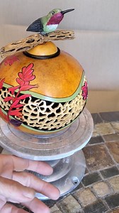 2.9K views · 257 reactions | Finished gourd with Red Yucca, Staghorn Cholla cactus, and an Anna's hummingbird. The humming bird is carved from basswood, and it's mounted on a piece of cholla skeleton. The lid is removable. I did this as a video so you can see all sides and count the filigree butterflies! | Bonnie Gibson Art | Facebook