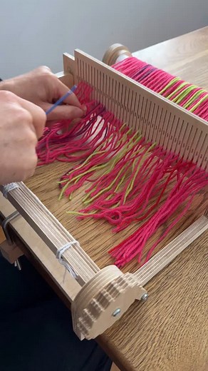 Threading an 8epi heddle with DK yarn on the rigid heddle weaving loom. Our TabbyandTweed YouTube channel has a warping tutorial if you are looking for help in setting up a rigid heddle loom. #weavingloom #rigidheddleweaving #learntoweave #warpingaloom | TabbyandTweed