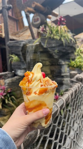 Pineapple Upside Down Sundae from The Tropical Hideaway! This is DOLE Whip Pineapple, caramel drizzle, and pineapple upside-down cake topped with a maraschino cherry. We loved this and thought the flavors worked together perfectly. | Mickey Visit Secrets