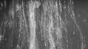 Particles and debris falling through water 02 Free Stock Video Footage