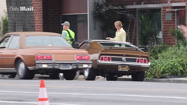 Brad Pitt steps out on set filming for the Once Upon a Time in Hollywood sequel