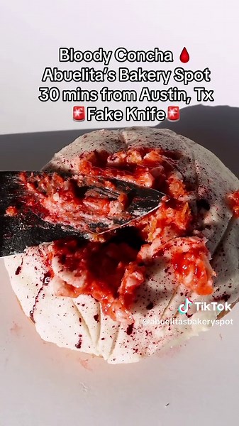 🔪🩸Bloody Concha🩸🔪 Infused with a delicious strawberry filling that creates a striking visual resemblance to a bloody concha when punctured. Don’t miss out on this unique and tasty treat! 📍 Available at both locations so make sure to stop by !! ⚠️ TW: KNIFE ⚠️ #halloween #halloweencostume #blood #pastry #concha