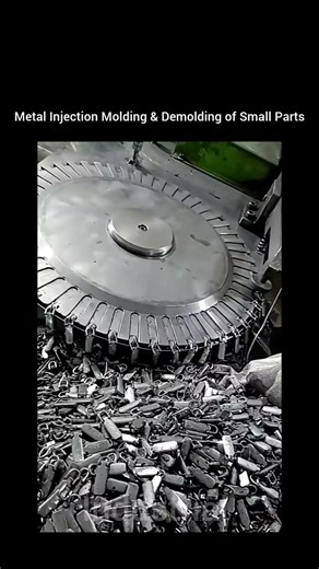 Industrial tube on Instagram: "This video showcases a metal injection molding (MIM) process where small metal parts, such as clips or fittings, are being produced, demolded, and collected. Metal injection molding combines the design flexibility of plastic injection molding with the strength and durability of metals, enabling the production of complex geometries that would be difficult or costly with traditional machining methods. ⚙️ Molding Operation In this process, fine metal powders are mixed