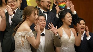 Ten LGBTQ couples tie the knot in a mass wedding in Hong Kong attended by their families and friends. Despite exchanging vows in the Chinese city, the newlyweds had to legally register their marriages in the United States via an online process, as Hong Kong does not recognise same-sex unions. | AFP News Agency