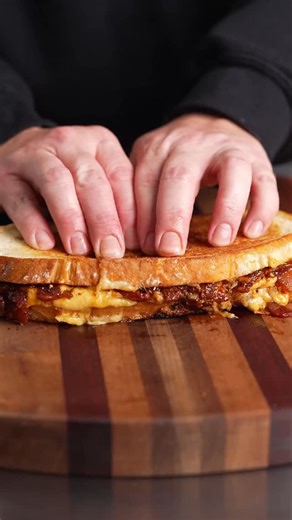Famous Dave’s BBQ bacon jam taking grilled cheese to another level 😮‍🔥 Give it a try and thank us later 😌 Full recipe below BBQ Bacon Jam Ingredients • 1 lb thick-cut bacon, chopped • 1 large onion, finely diced • 2–3 cloves garlic, minced • 1 cup Famous Dave’s Texas Pit BBQ sauce • 2 tbsp brown sugar • 1 Tbsp apple cider vinegar • 1 Tbsp Famous Dave’s Rib Rub Bacon Jam Directions 1. Cook bacon until crispy; remove and reserve ~2 tbsp bacon fat. 2. Add onion to fat and cook low 10–12 minutes 