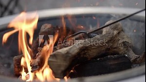 Preparing for BBQ. Open fire on barbecue grill. Barbecue flame. Burning wood at fireplace. Orange flames rising. Campfire.