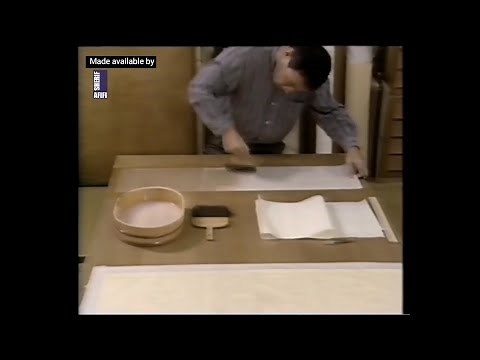 Paper restoration | Applying backing paper to a larg work