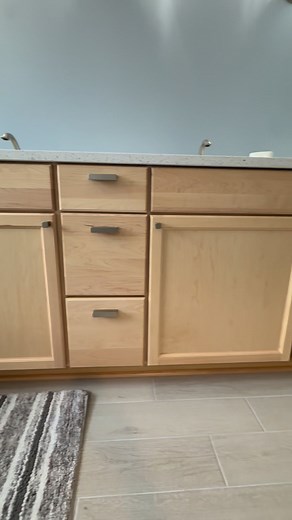 GLENMERE A master bathroom AFTER! New tile flooring and baseboards throughout. Level entry shower, skirted toilet, free standing tub, natural finish solid maple cabinets, quarts countertop, Moen fixtures with dual function shower, wall and ceilings tuned plus freshly painted, lighting upgrades. Almost done and just waiting on the frameless glass, special order mirrors, and the additional towel bars! 3-1/2 weeks start to finish! | Coastline Designs