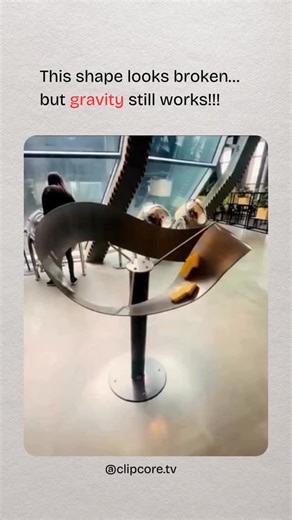 Clip Core TV on Instagram: "This sculpture is designed to hack your perception. It looks like objects are rolling uphill, but they’re moving downhill the entire time. The geometry manipulates depth cues and perspective, convincing your brain that gravity is failing — when it isn’t. Your eyes can lie. Math never does. Follow @clipcore.tv for more mind-bending clips 🌍 #mindblown #opticalillusion #engineering #physics #artandscience"