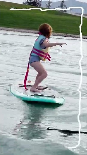 ADLEY can SURF! Learning to ride waves on a paddle board at Pirate Island! Family beach day #Shorts