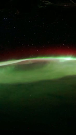 Earth's nightly spectacle: Auroras and city lights from space